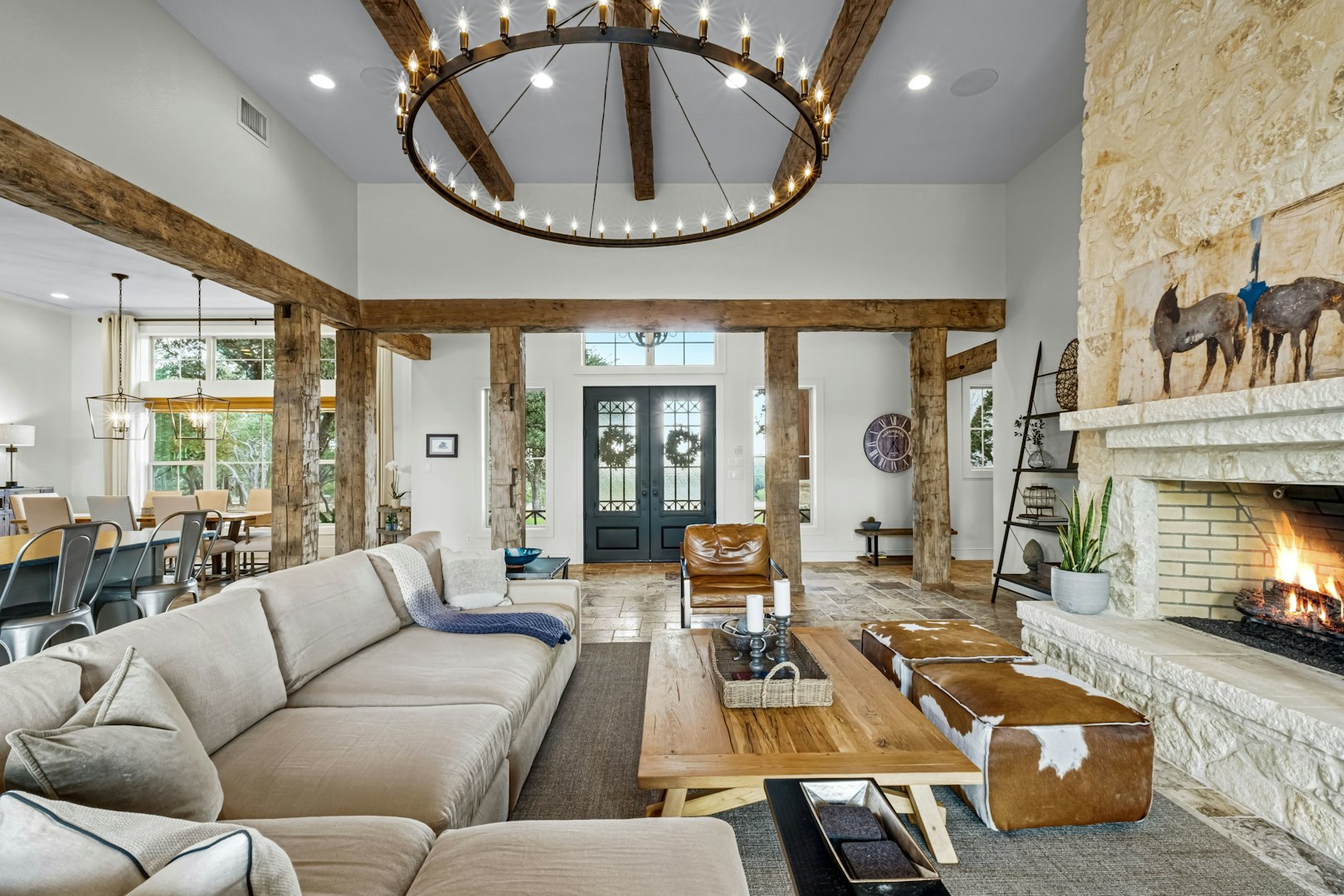 Grand living room with historic beams and stone fireplace