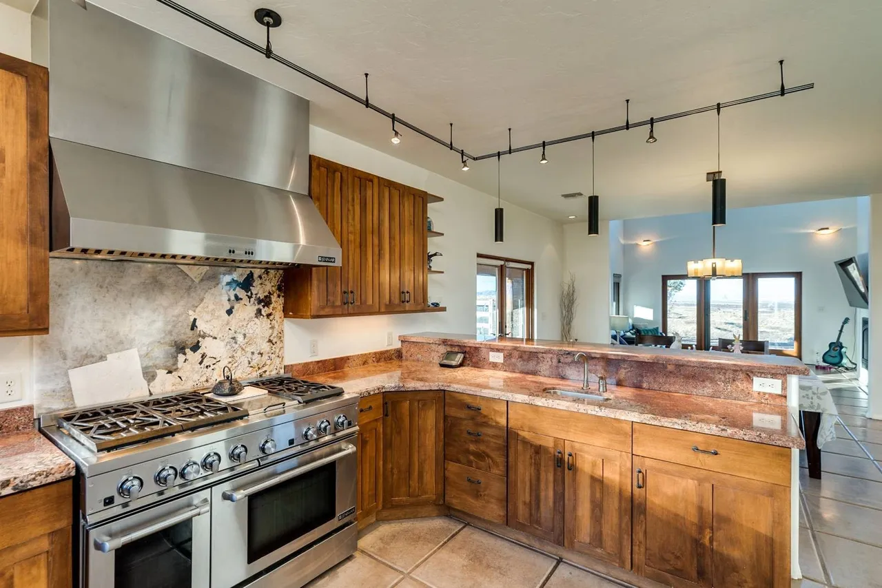 The Gourmet Kitchen · Cherrywood & Exotic Granite
